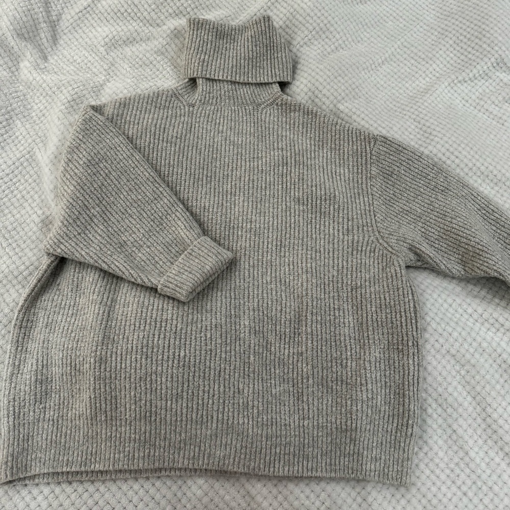 Oversized turtle neck sweater with cropped sleeves
